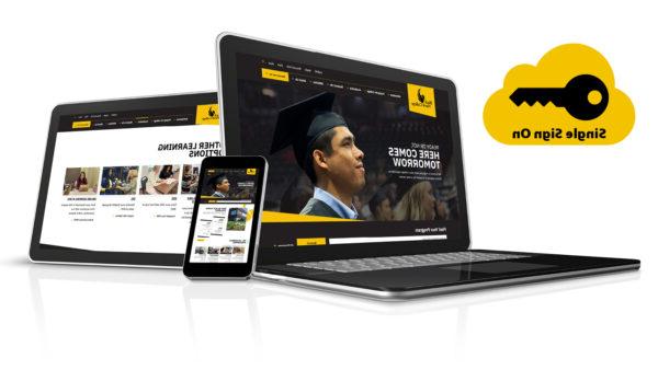 a laptop and tablet with a yellow and black website